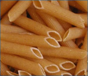 Close up uncooked penne pasta